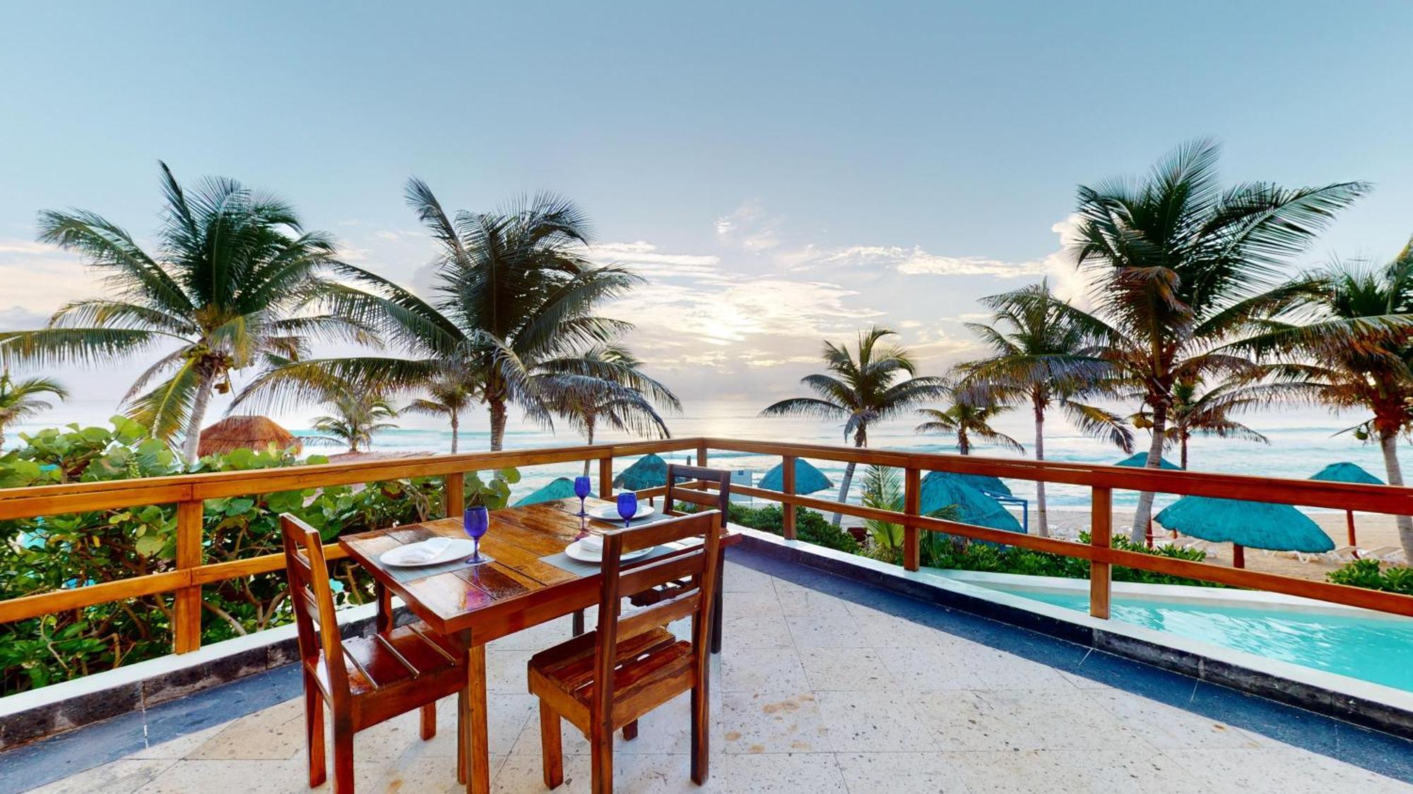 The Pyramid Cancun By Oasis Exterior photo Beachfront dining at the Grand Palladium Resort & Spa, Playa del Carmen, Mexico